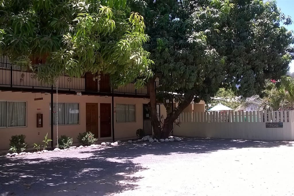 Sideview of Cabins 1-8 with fence surrounding Pool