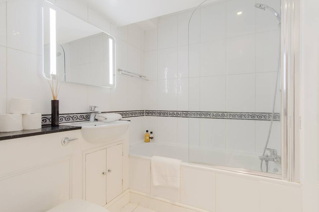 A bathroom stocked with towels and toiletries...