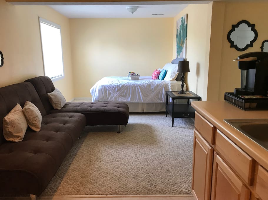 Room set up for a cozy couples get away. Queen bed.