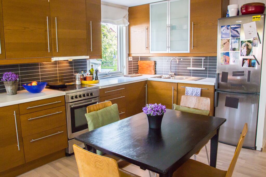 Kitchen with seating for four. Extra chairs, including child seating, can be provided.