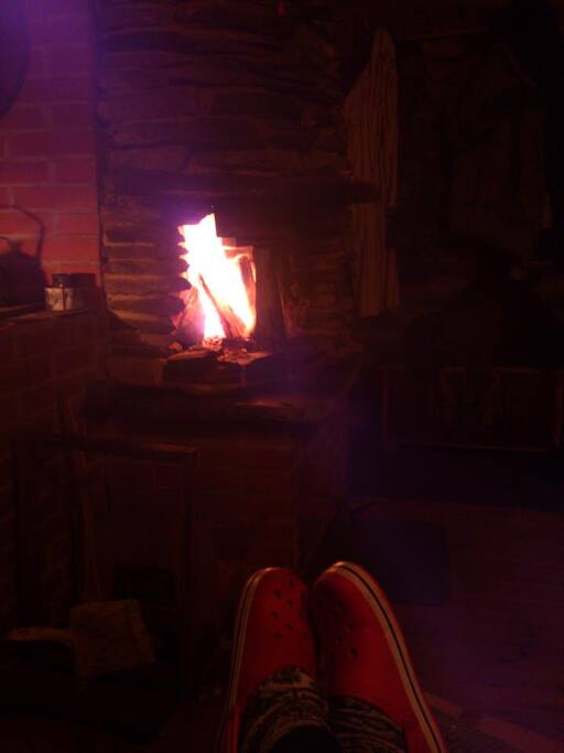 Someones shoes and fire.