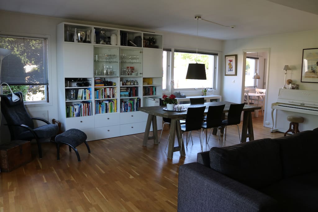 Living room - with a nice dining table, a cosy "reading corner", and a piano - if you like to play! :)