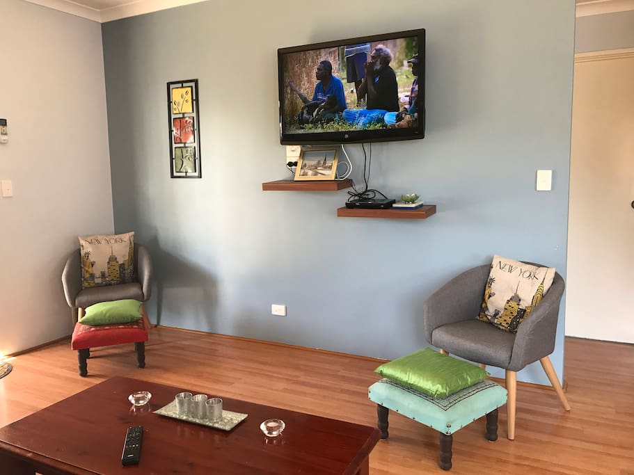 Two TVs with DVD library