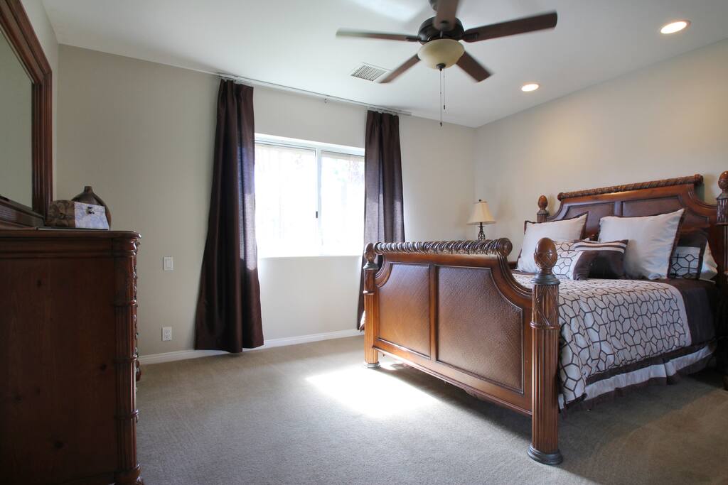 Guest bedroom with queen bed. This room has an en suite barroom attached.
