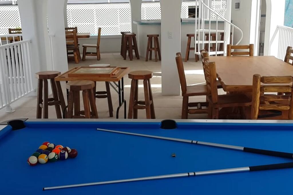 A gazebo with an outdoor shower, bathroom and bar has pool table games ample space for big parties as well as a roof top level with amazing views of the Caribbean Sea