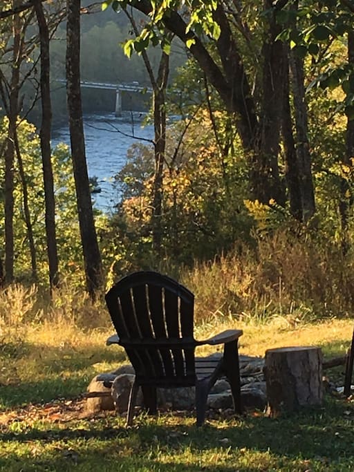 The view of our beautiful French Broad river as seen from your bed in this tent and from your private firepit