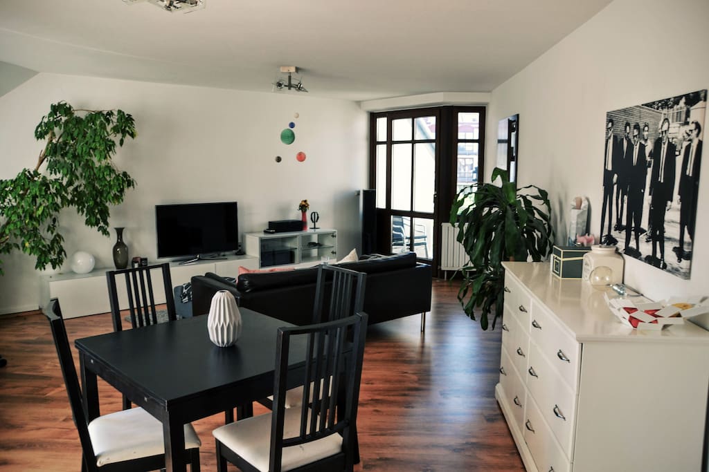 This is beautiful big living room with the first balcony on the right.