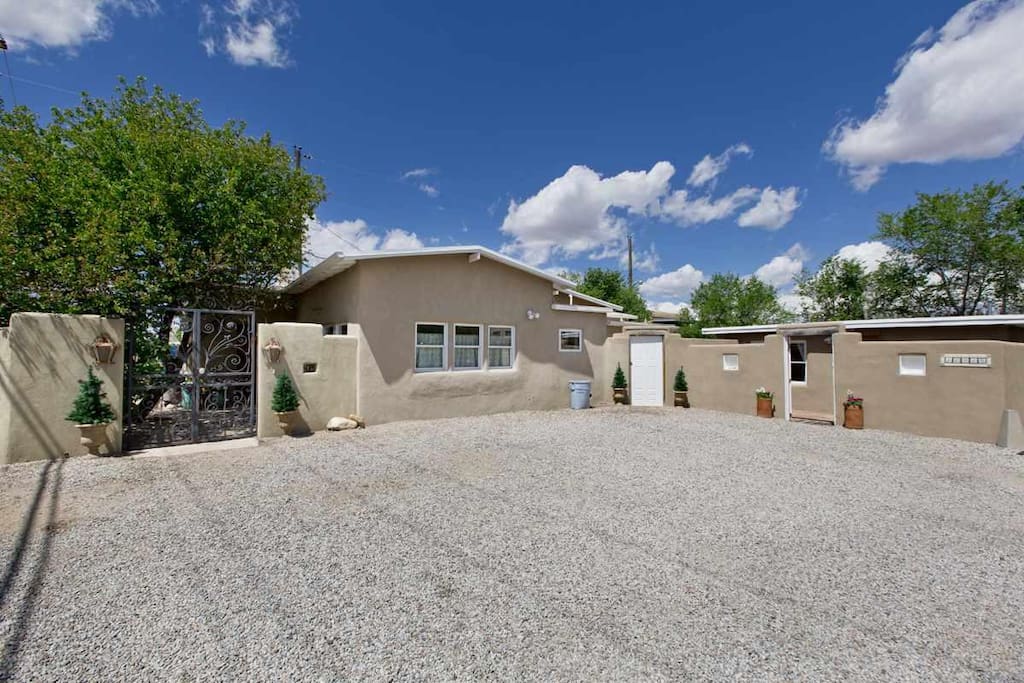 Parking area for main house on left and casita at right (open gate)