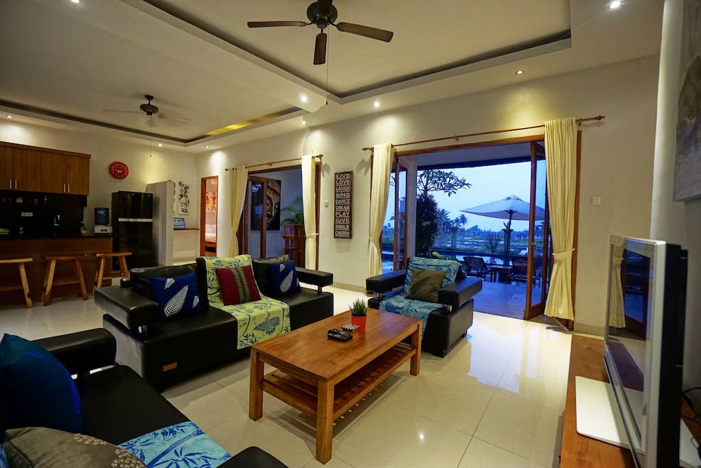 The main house with cozy living room, kitchen, dining area, and a nice view and breeze.