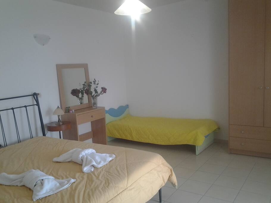 The room has one double and one single bed