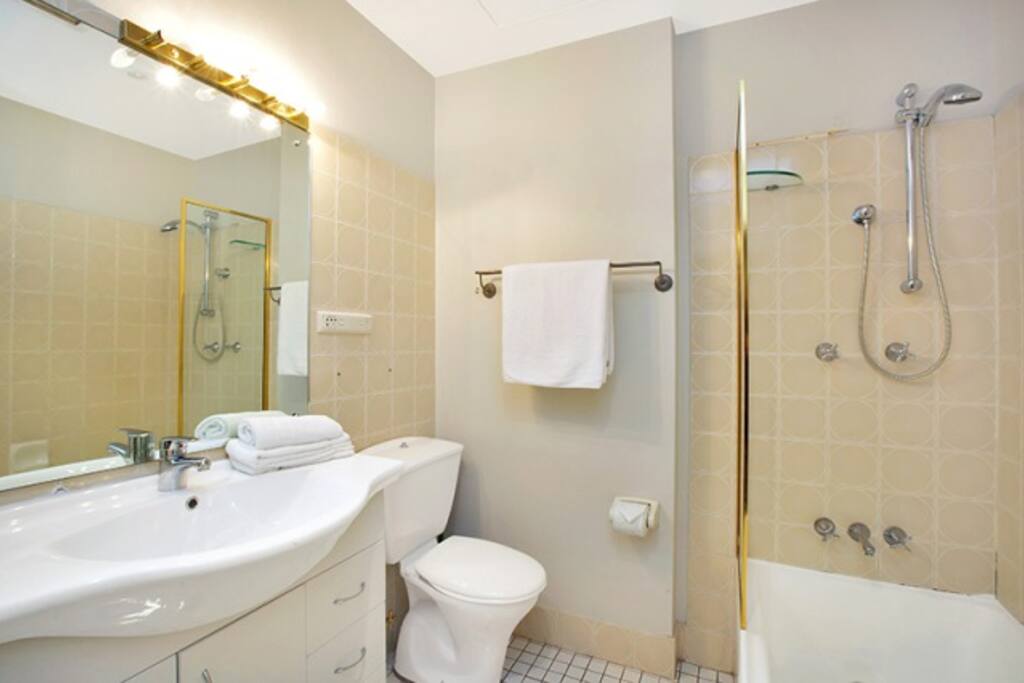 Full sized bath with shower. Washing machine & dryer