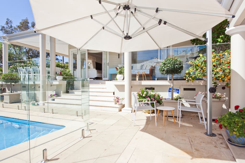 The tiled area around the pool offers an umbrella and access to the cabana.