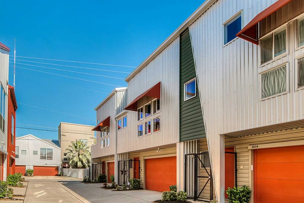 A spacious, modern townhouse loft features designer architecture and large, open living spaces.