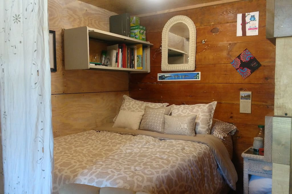 Queen bed in the nook below the loft.