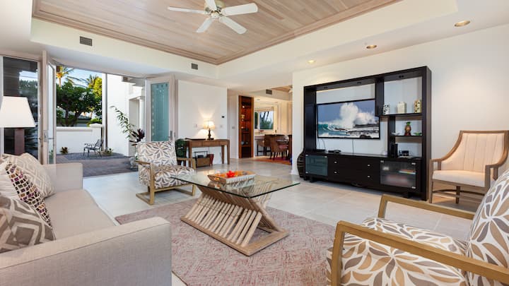Large open concept living room is bright and airy