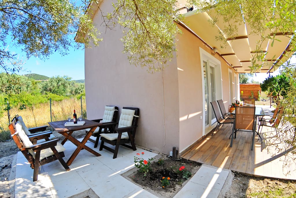 Rest areas in veranda (patio in front yard) and back yard