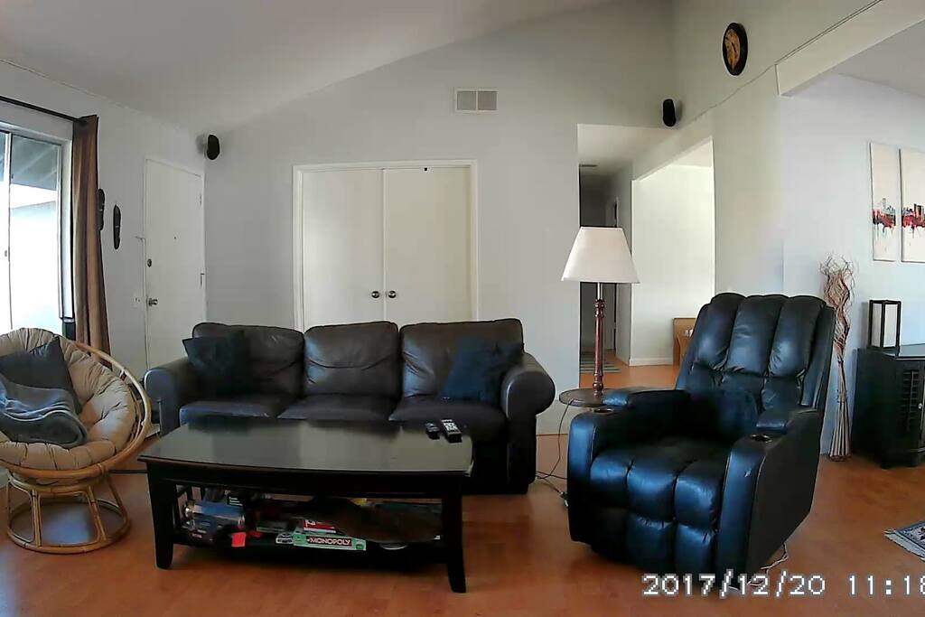 Spacious, comfortable living room with lots of natural light
