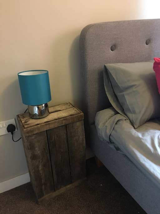 A touch lamp and vintage crate.