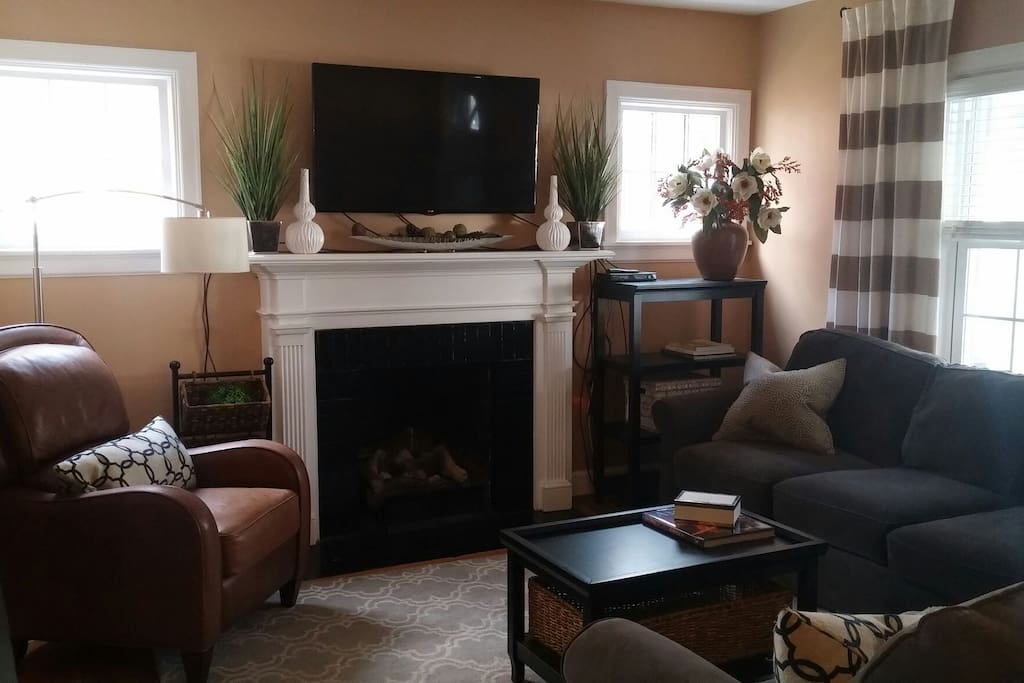 Gas fireplace and mounted TV are focal in the first level living area