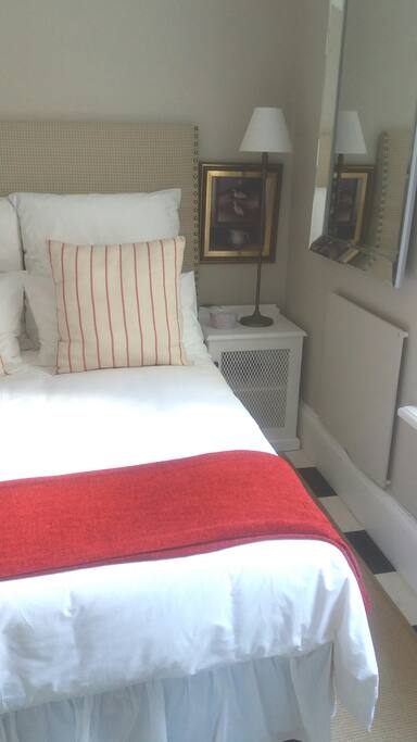 Bed-side cupboard (with hair dryer), large mirror and wall heater