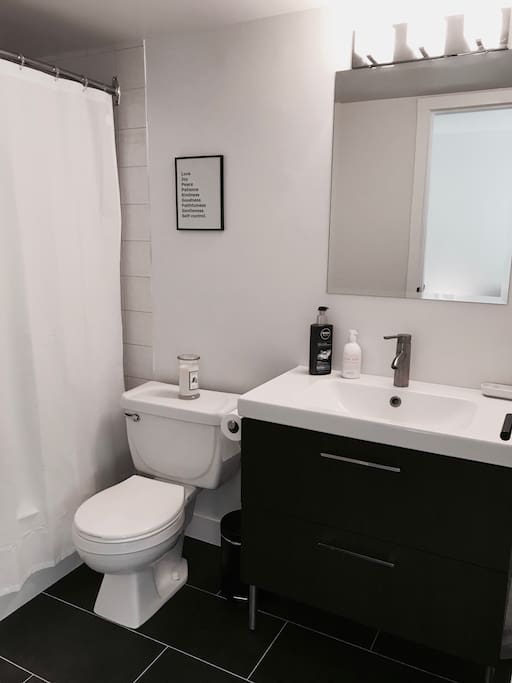 Private bathroom in bedroom with full bathtub.