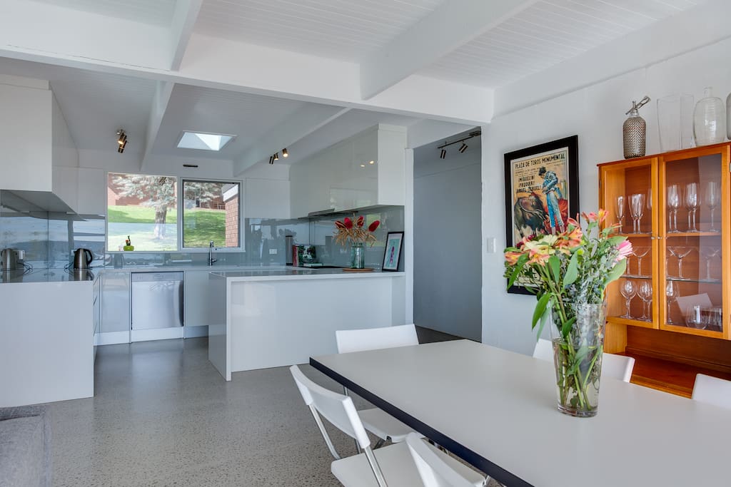 The kitchen has a gas cooktop, oven, dishwasher, fridge, and a butlers pantry with a bar fridge