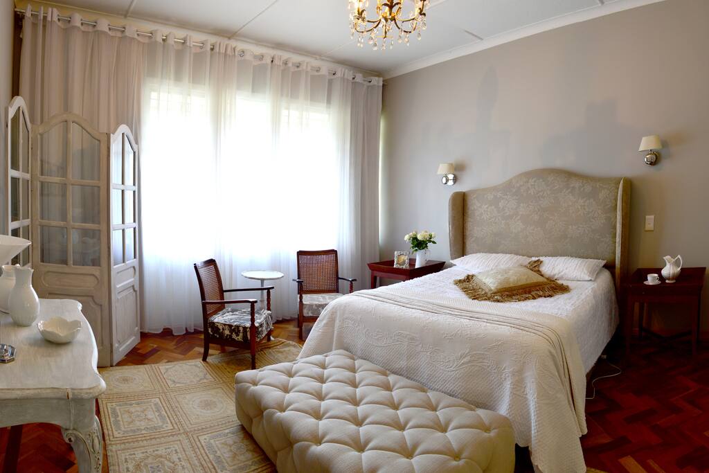 Room 1. Nights in white satin, never reaching the end.... in this boudoir of magnolia shades... diaphanous drapes diffuse daylight...a bed dressed in virgin linen beckons. A private space where time stands still. The room breathes a feminine ambience...an adjoining lounge invites you to take afternoon tea, relax with a book, dream. The bathroom is large, the shower perfect for two. in true French style, a bidet adds the intimate toalette touch. Perfect for female guests, or smitten couples.