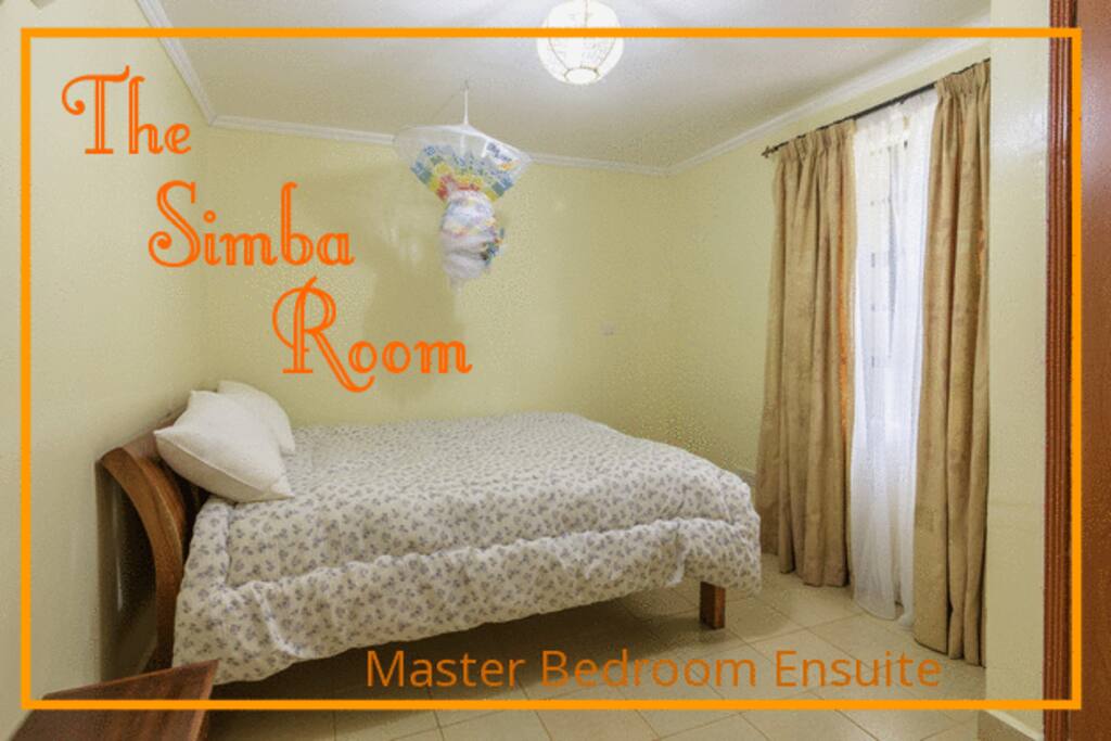SIMBA ROOM (SWAHILI FOR LION) LOCATED DOWNSTAIRS. This is the SECOND MASTER BEDROOM. Enjoy large wall to ceiling closets (wardrobes), large windows, spacious room and a MASTER BATHROOM ENSUITE.