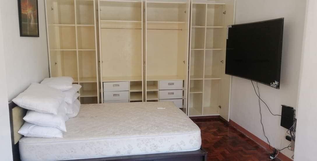 Masters bedroom with 65 inches smart TV