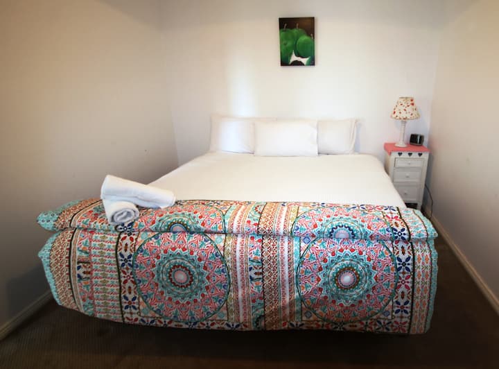 Downstairs bedroom 3, shown here as a king bed but can be 2 singles on request.
