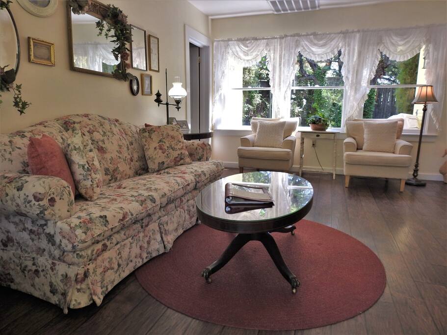 Cheerful living room overlooks private back garden