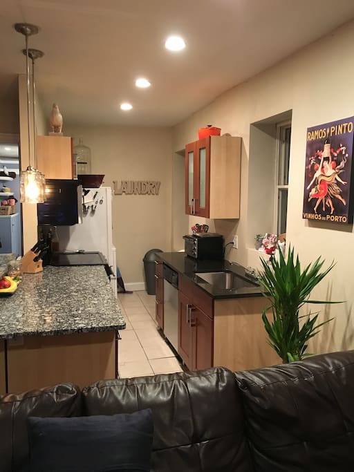 Kitchen, Washer and Dryer next to refrigerator