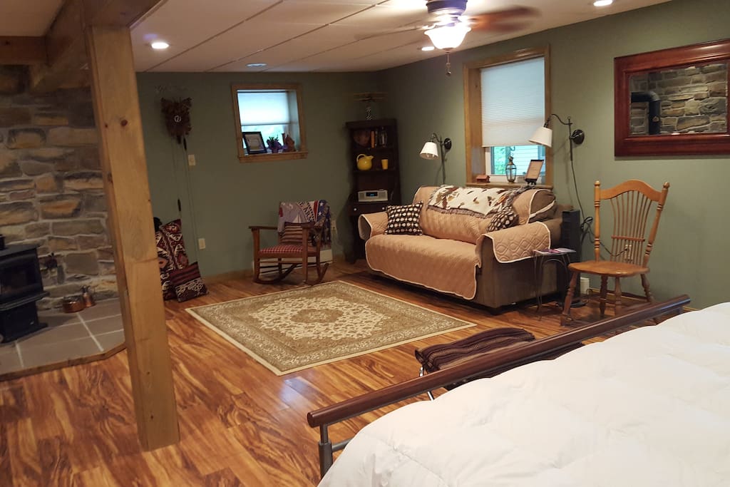 New couch with a pull out bed. Wood burning stove in the corner.