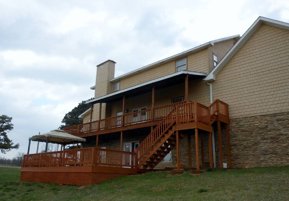 2 level large back deck, includes, lighted gazebo, fire pit, seating, BBQ grill