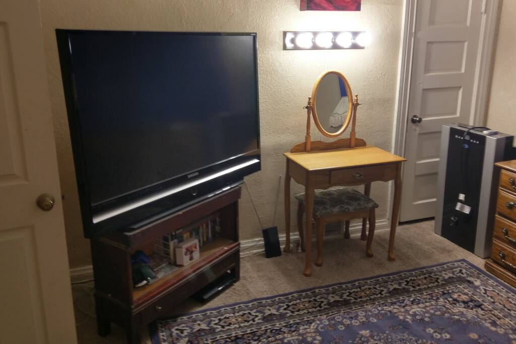56" HDTV with Playstation 3 (and many games), OTA antenna and Chromecast (broadcasts content and streaming from your phone).
Also vanity with strong lighting, and 14,000BTU air conditioner for hot Denver summers.