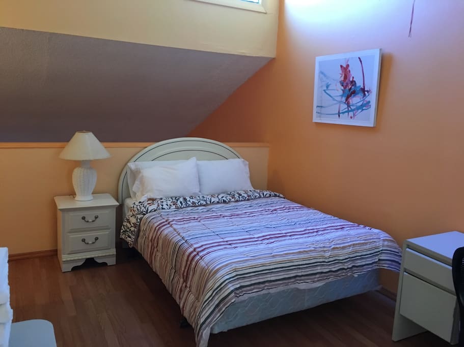 Large comfortable bedroom with closet.