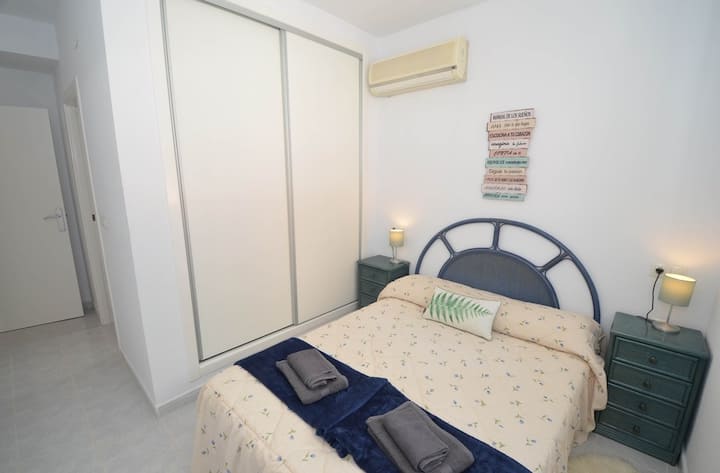 Also in this room there is air conditioning, large wardrobe. The ironing board and iron are kept in here, there is also a safe in the wardrobe if needed. You can also see the door to the en-suite bathroom. Bedrooms all  have quilts and extra pillows.