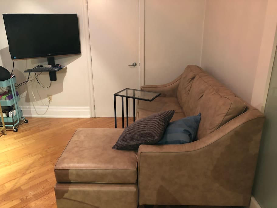 Large sofa in the living room that can sleep an extra guest. Enjoy relaxing at the end of your day with 42” flat screen tv connected to google home and chromecast, you can also hook up your own computer via HDMI.