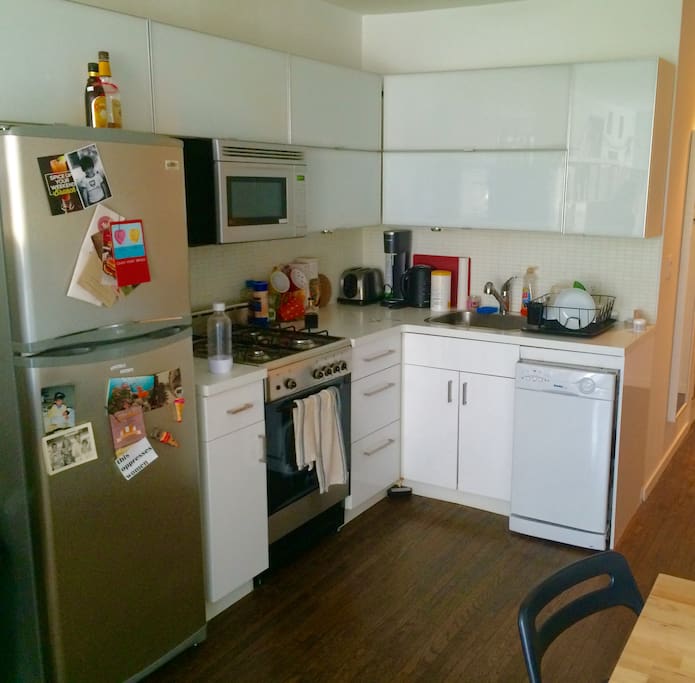 kitchen has all the basics: microwave, oven, dishwasher