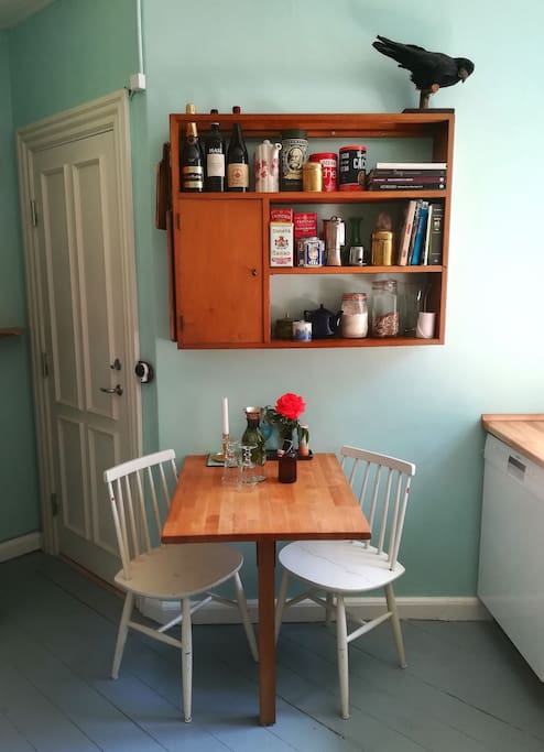 Kitchen and dining table and dishwasher.