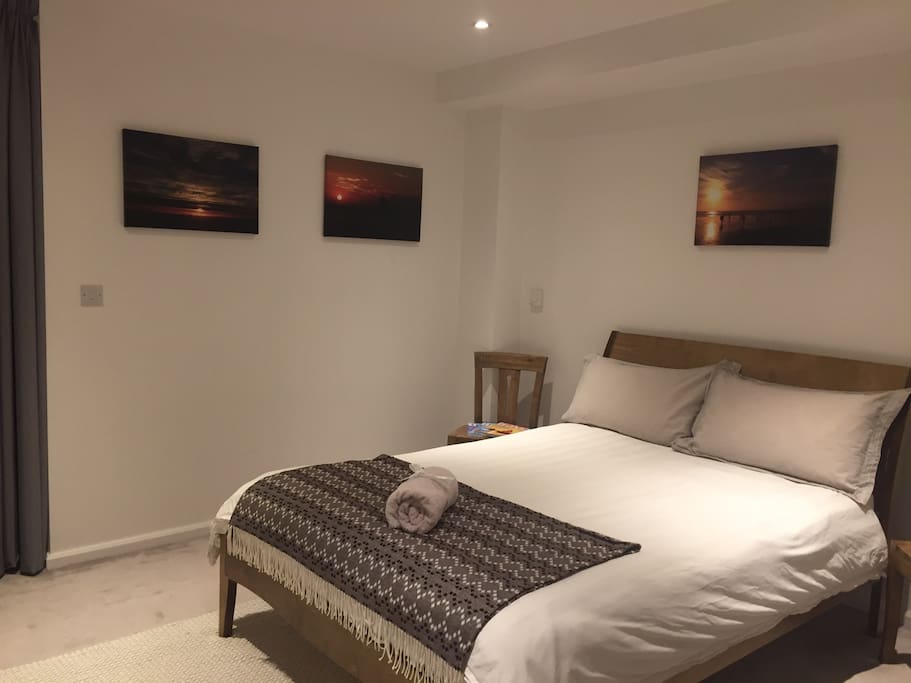 Warm spacious bedroom with luxury double bed