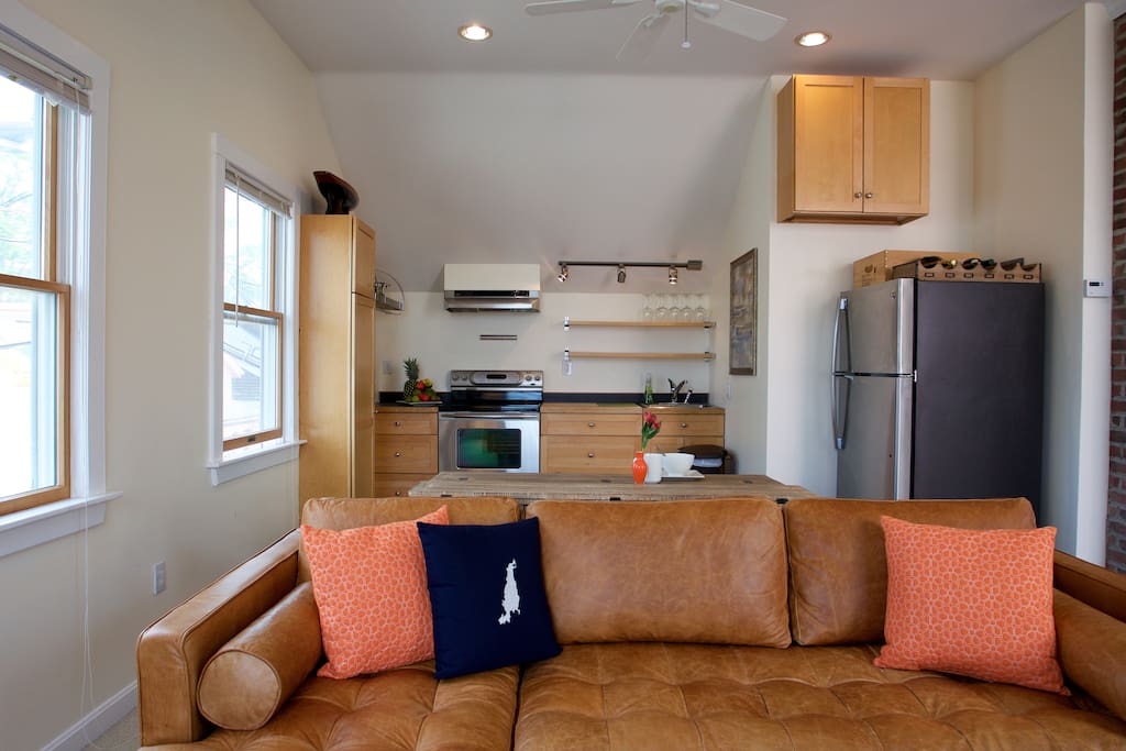 sofa and kitchen area in background