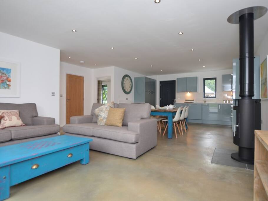 Open plan lounge with french doors to garden