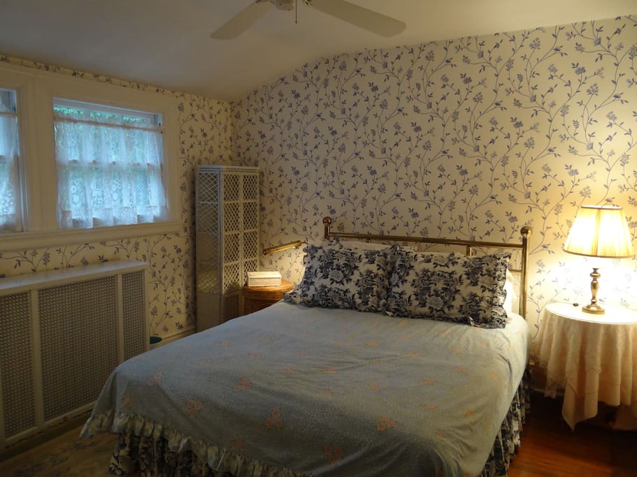 This listing features the blue and white guest room, with a Queen size bed on third floor and ceiling fan.