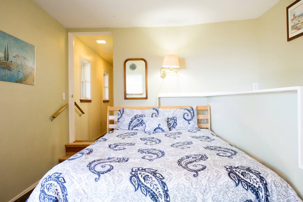 Comfy queen-size bed in the front room