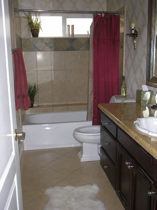 You share the downstairs full bathroom with your host, but you have prioity.