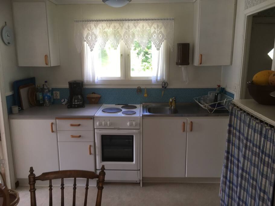 Kitchen with stove, oven, hot and cold water
