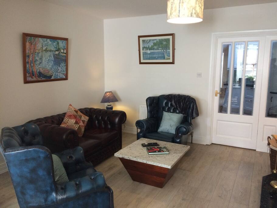 Comfortable living space with cosy fire and adjoining kitchen