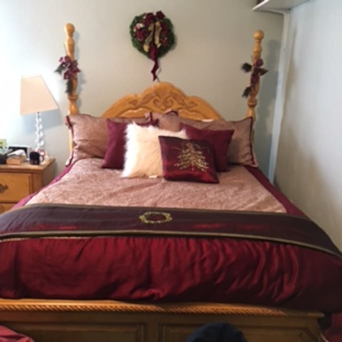 Queen size bed with closet and dresser. Wake up to the morning sun.