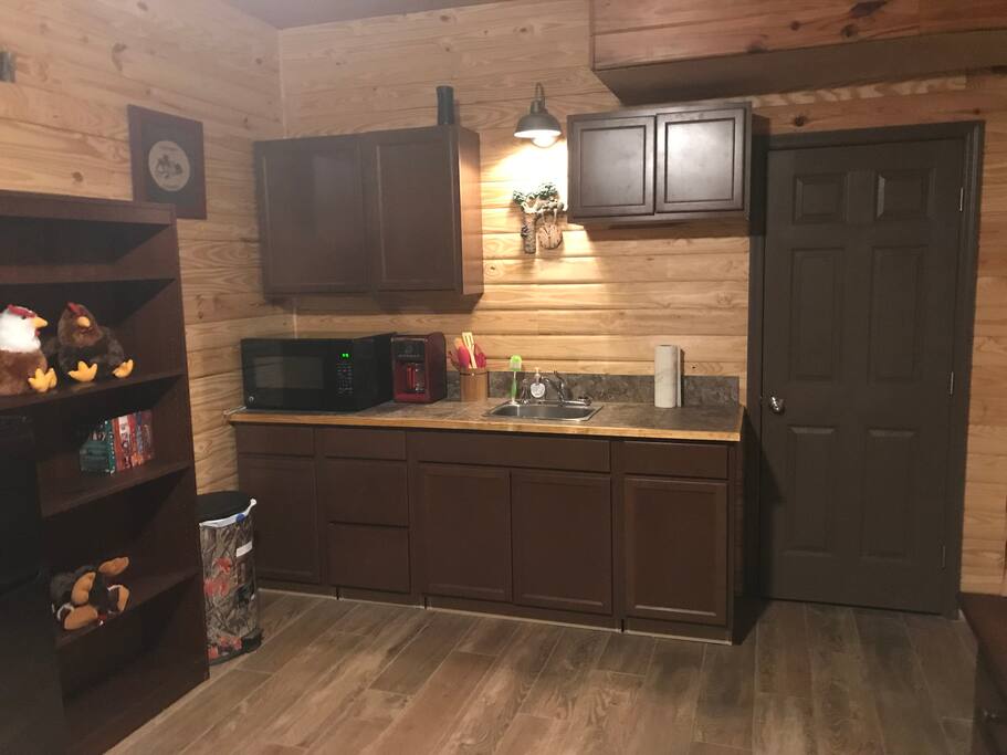 Kitchenette with refrigerator and microwave